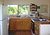 The light and bright kitchen opens into the living area.