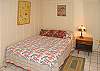 The second bedroom is downstairs near the living room and has a double bed.