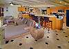 The great room has a large kitchen and living area all on a beautiful Travertine floor.