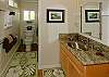 A beautiful updated bath with large walk-in shower and granite countertops. You get the old cottage feel but not the old sink and tub.