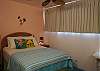 Lay back in the Queen sized bed in the bright Hawaiian bedroom.