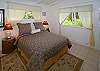 One of the two bright bedrooms with queen beds at Sunrise House.