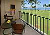 Relax on your lanai with a tranquil view of the Pacific Ocean across the expansive Kihei Surfside lawn.