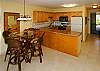 It's such a pleasure to have an upgraded kitchen with gorgeous granite countertops and a counter-height dining table to take full advantage of that great view!
