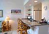 Recessed lighting above the dining area creates a special ambiance.