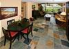 The beautiful slate floor sets the tone for the design elements in this beautifully furnished condo.