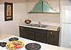 The galley kitchen is fully equipped, and don’t forget the barbecues near the pool!