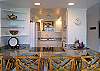 Dine at the spacious marble countertop with views of the elegant kitchen.