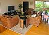 The living area is an extension of the dining area with stylish seagrass furnishings. Kick back and relax with a big-screen plasma TV and surround-sound speakers.