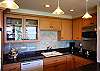 The kitchen and baths have been completely remodeled with European cabinets, granite counters, and contemporary lighting. All new appliances make this gourmet kitchen a delight to use. Note that the kitchen has a cooktop and convection microwave oven but no conventional oven.