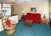 The comfy chairs and good reading lights in Surfside 405 let you relax and enjoy the indoors.