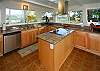 Fantastic kitchen with lots of granite counter space, a flat-top cook stove, and views! (No traditional oven, but who wants to bake in Hawaii except on the beach?)