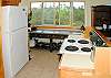 The house offers a well-stocked kitchen with quality appliances, cookware and utensils. Off to the side a nice desk provides a work space with a high-speed Internet connection, both Ethernet and wireless.