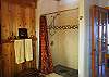 Tiled shower in the bathroom.