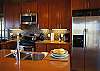 The kitchen is elegantly decorated and well stocked.