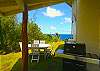There is a gas grill under a covered lanai and seating for your ourdoor meals.