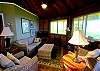 The living room at Kahikole is complete with flat screen TV, DVD player and high speen internet access.