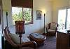 The living room at Aloha Cottage is cozy and bright.