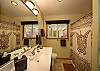 The main bathroom is light and clean.