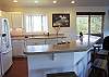 Open kitchen and seating at the bar.