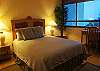 The master bedroom has a queen bed, large closets, warm tropical tones, and a great view!