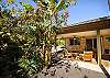 Lovely landscaping surround Luana Hidaway