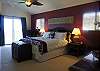 The Orchid Suite is elegant in eggplant with a Cal-King size bed, ceiling fan, ocean view lanai and full ensuite bathroom.