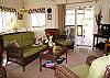 The living room at Princess Cottage is comfortable with a small TV and DVD player.