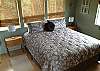 The main floor bedroom is peaceful and comfortable with a Cal-King bed and en-suite bathroom.