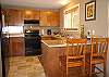 The kitchen is complete with granite counter tops, tile floors and everything you'll need to prepare your wonderful Hawaiian produce!