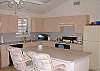 Large, complete kitchen to prepare your catch of the day! Dining seats eight people comfortably with a beachfront view.