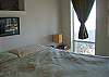 Master bedroom has king size bed and beachfront view from deck