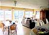 Main House with spacious livingroom and view of the canal. Relax in luxury and comfort in this beautifully decorated, modern main house.