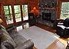 Living Room with Woodburning Fireplace overlooking Lake Blue Ridge and Surrounding Mountains