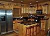 Fully equipped kitchen with 2 bar seats