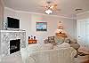 Relax In Comfortable Elegance With an HDTV and River Rock Fireplace