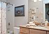 Plush Towels, Hair Dryer and Hand Mirror in Each Bath