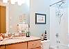 Luxurious Bathrooms With Granite Counters and Tile Floors