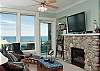 Relax In Comfortable Elegance With a Plasma TV and River Rock Fireplace