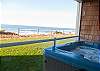 Enjoy The Sights And Sounds Of The Ocean From The Private Hot Tub