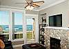 Relax In Comfortable Elegance With an LCD TV and River Rock Fireplace