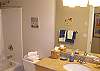 Luxurious Bathrooms With Granite Counters and Tile Floors