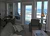 Relax In Comfortable Elegance With an LCD TV and River Rock Fireplace