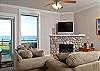 Relax In Comfortable Elegance With an HDTV and River Rock Fireplace