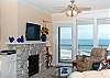 Relax In Comfortable Elegance With a Plasma TV and River Rock Fireplace