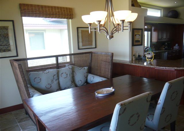 Enjoy dining at this cozy kitchen nook or outside on the 450 sq.