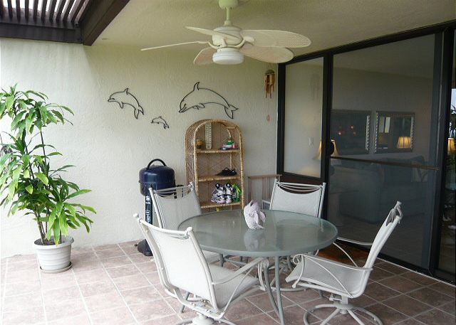 Large lanai with an ocean view off the living room.