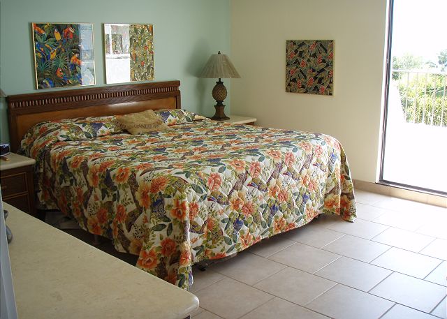 King bed in one of the master suites.