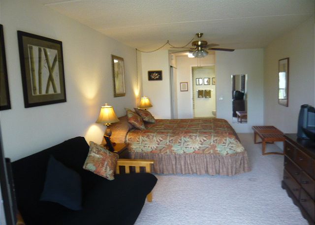 King Bed, Futon, and Small Lanai off the Bedroom.