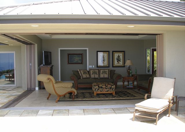 Glass sliders opened, looking inside from the back yard.